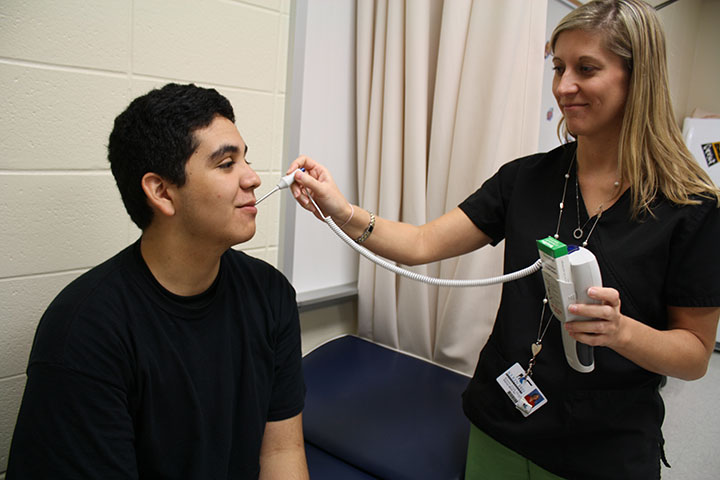 Freshman Alfred Bannios gets a checkup in the nurses office. 