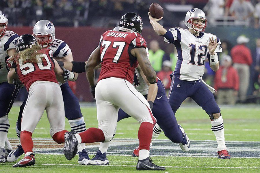 New England Patriots Tom Brady (12) passes during overtime of the NFL Super Bowl 51 football game against the Atlanta Falcons Sunday, Feb. 5, 2017, in Houston. (AP Photo/Tony Gutierrez)
