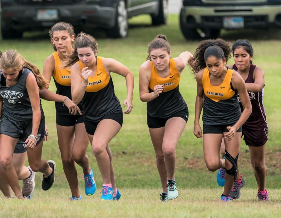 The Oak JV Cross Country Team gets off the line at the start of the Heat Wave Meet in Tomball, August 18, 2018. 