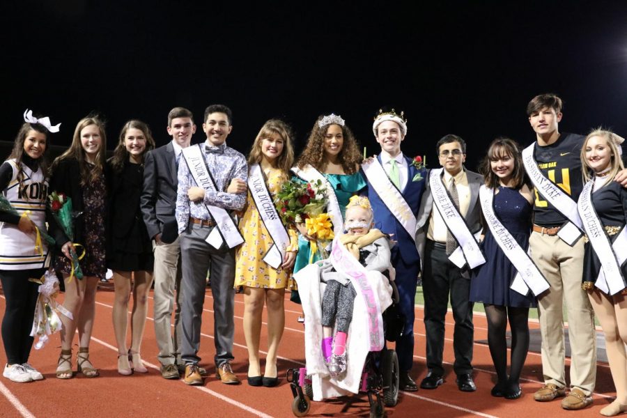 The 2018 Homecoming Court surrounds Jacqueline Dyer after she is crowned as an honorary Homecoming Princess. Dyers organization namesake, Just for J, was the recipient of $15,000 raised by the Klein Oak community.