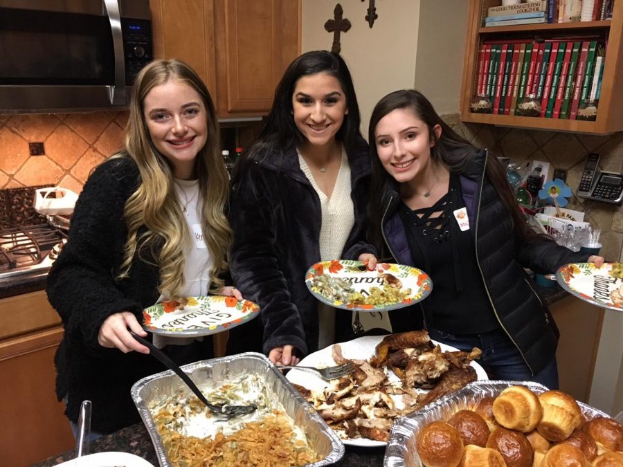 Diamond Girls Kennedy Adelman, Jazmine Ceniceros and Michaela Poore fill their plates with homemade servings.