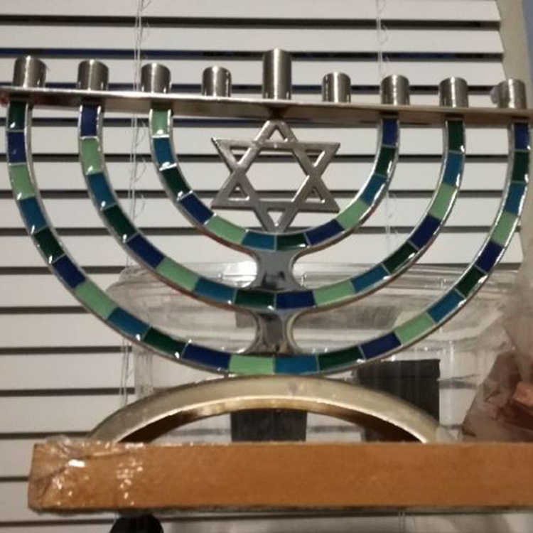 A+centerpiece+of+the+celebration+Hanukkah+is+the+menorah.+The+ancient+lamp+holds+nine+candles.+The+lighting+of+eight+candles+symbolizes+the+number+of+days+that+the+Jewish+temple+blazed%2C+with+the+ninth+used+for+lighting+the+others.+This+is+the+menorah+used+in+the+Greenwald+household+and+apart+of+their+religious+traditions.