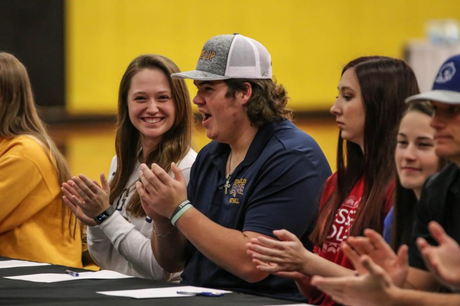 Lacy Ornelas signs her commitment papers to Ouachita Baptist University next to Garrett Butler who signs to Texas Wesleyan University Fort Worth.