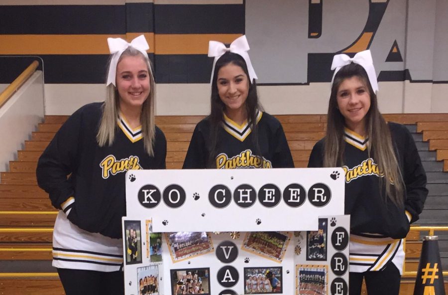 Drumming up interest as the 8th graders from Hildebrandt, Hofius, and Krimmel visit the campus, juniors Madi Gorton, Jazmine Ceniceros and Clara Ramos gather around a cheer tri-fold which features highlights from the season of all three squads.