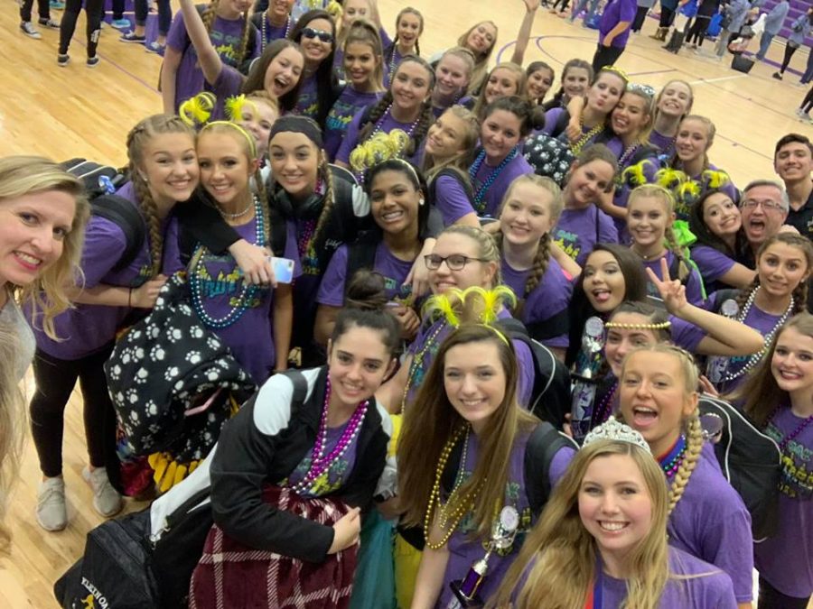 Celebrating big awards after a long day of competing, Strutters pose for one last picture before their night ends.