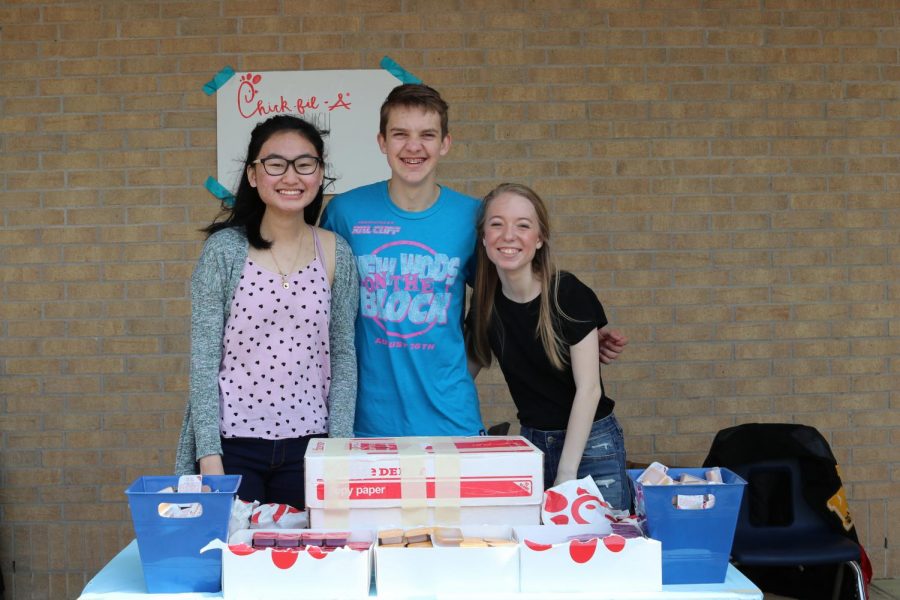 Selling Chick-Fil-A for the Class of 2021, Catherine Huynh, Blaine Wiegand and Macie Thompson show their school spirit by donating their time for the carnival.