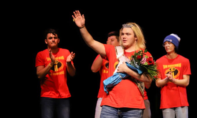Tayton Coffelt waiving to the crowd after receiving the title of Mr. Debonair 2019.