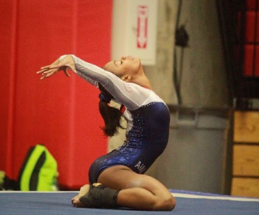 Sophomore Leah Smith strikes the ending pose to top off her difficult floor routine at the regional qualifying meet in Oklahoma, April 12. Because of her success at the meet, Smith now heads to the 2019 Womens Junior Olympic Nationals in May.