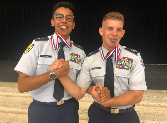 AFJROTC cadets, juniors Yash Varma and Levin Truitt, celebrate their 1st place winning together. 