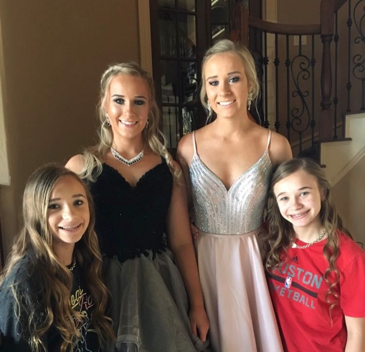 Elder twin sister get ready to go to prom as identical young twin sisters see them off.
Two sets of identical twins in one family is a one in 70,000 chance.
