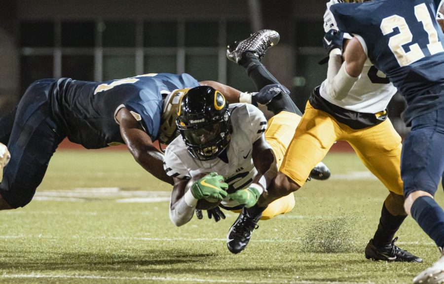 Senior corner back Dwight McGlothern dives for the first down. Halfway through district play, McGlothern has acquired over 700 yards, 62 of which came in one reception against Collins.