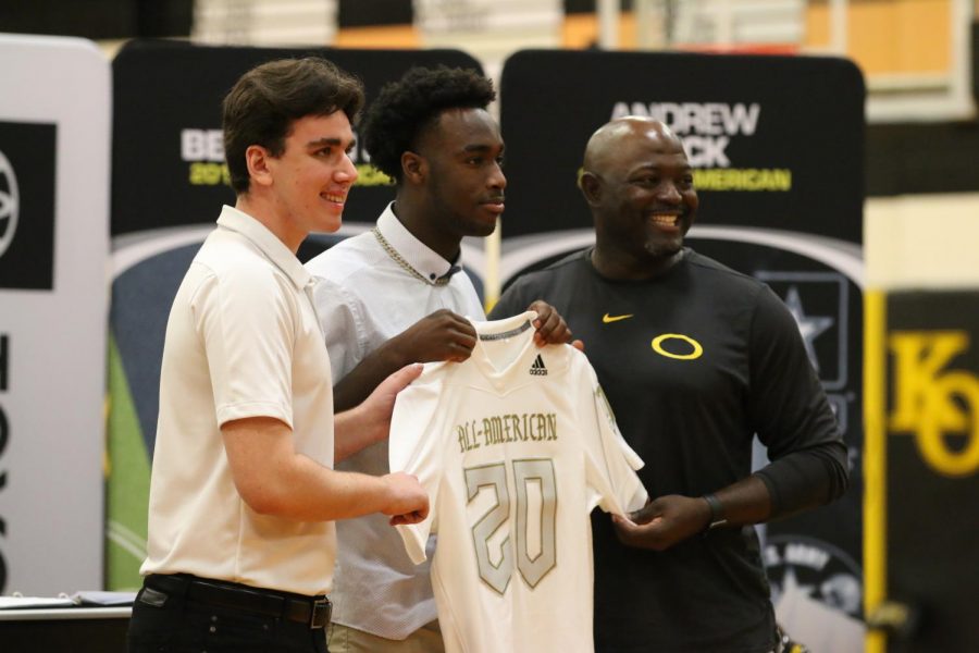 Along with the bowl game representative, senior Dwight McGlothern and Athletic Director and Head Coach Jason Glenn present #20 his jersey for the U.S. Army All-American Bowl game. McGlothern was greeted in pep rally fashion by other athletes to celebrate his selection.