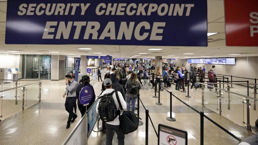 Entrance to the security checkpoint where airport officers make sure all passengers are not threats to others while traveling.