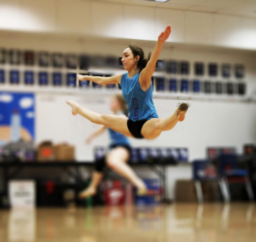During her Strutter class period, freshman Meredith Carrasco practices her turning center leap. This advanced leap is a part of the team jazz choreography. 