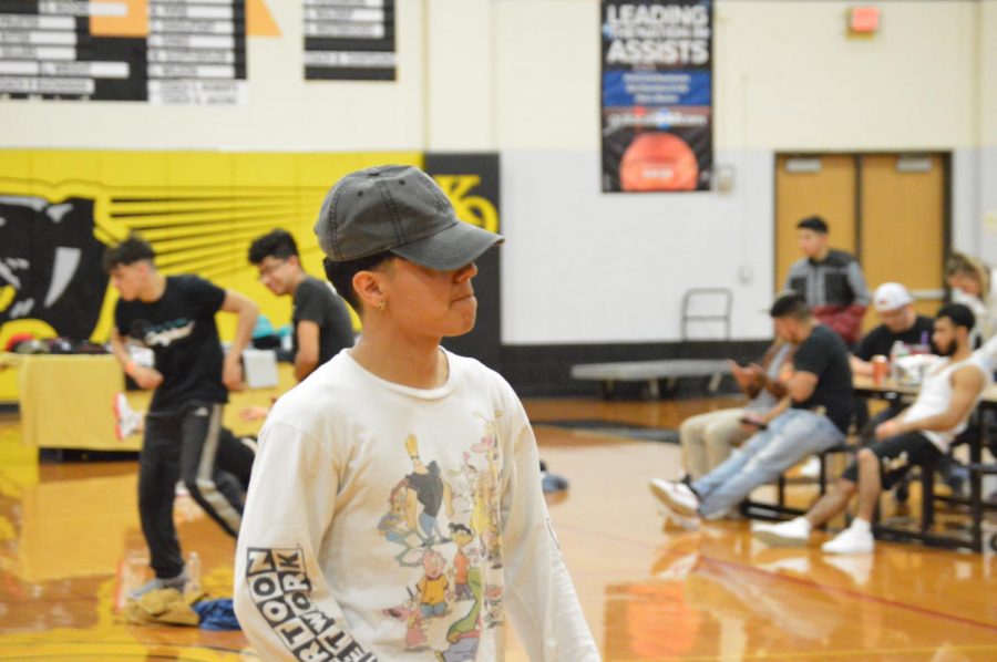 Senior Sam Salazar and his confidence making a statement. Salazar gets into the competitive mindset getting ready to throw down on the dance floor. Keeping with the b-boys style, Crew members like to wear loose and comfortable clothing which allows them to show off their best skills.