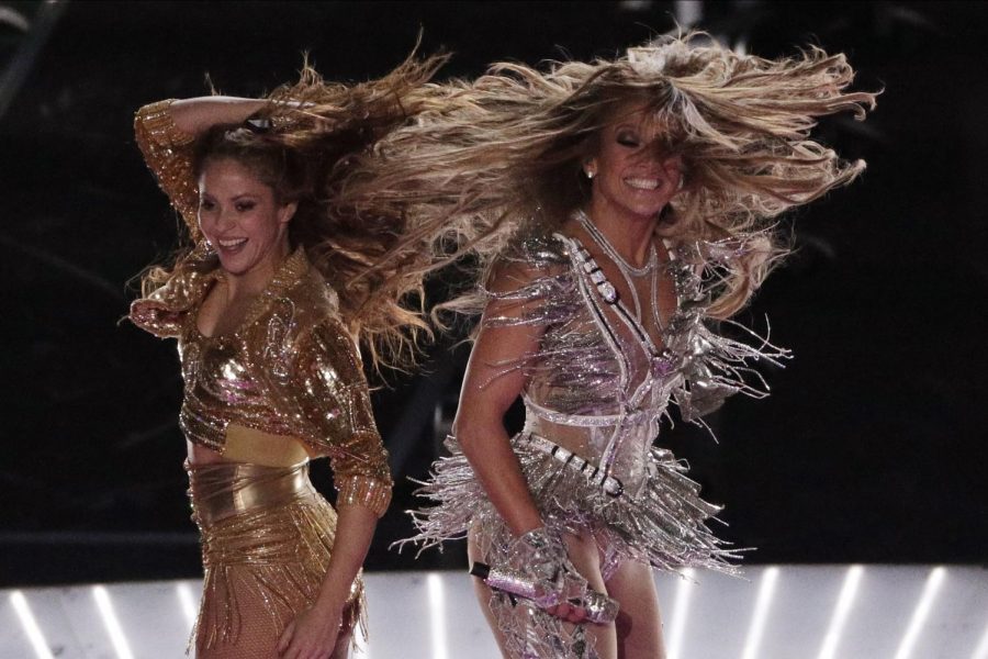 Zealous performers Shakira and J.Lo strike a pose during their Feb 2 Super Bowl halftime performance. The artists exuberant dancing and skimpy costuming caused an uproar from viewers.
