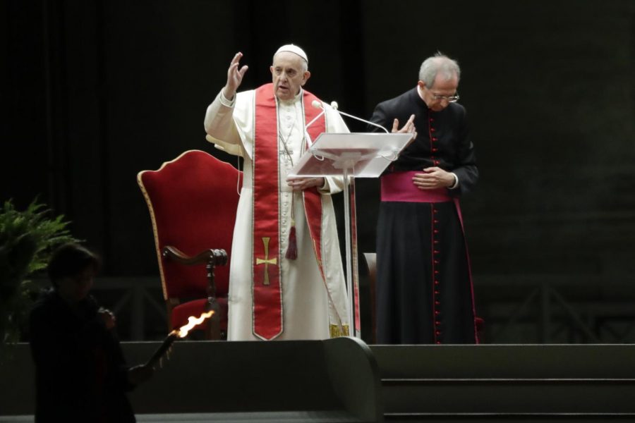 Pope Francis is flanked by Mons. Guido Marini as he delivers his blessing during the Via Crucis – or Way of the Cross – ceremony in front of St. Peters Basilica, empty of the faithful following Italys ban on gatherings during a national lockdown to contain contagion, at the Vatican, Friday, April 10. In Spring and Tomball, following the guidelines set forth by Governor Greg Abbott and by recommendations of local officials, churches are planning to hold all Good Friday and Easter services online to keep their parishioners safe from COVID-19.