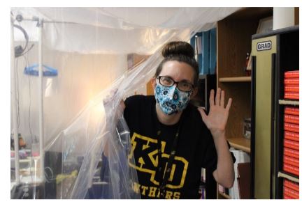 English teacher Vanessa Riley gives a sneak peak into her work space. In order to maintain social distancing in her classroom, Riley installed a makeshift barrier to protect herself, her students, and especially her family members.