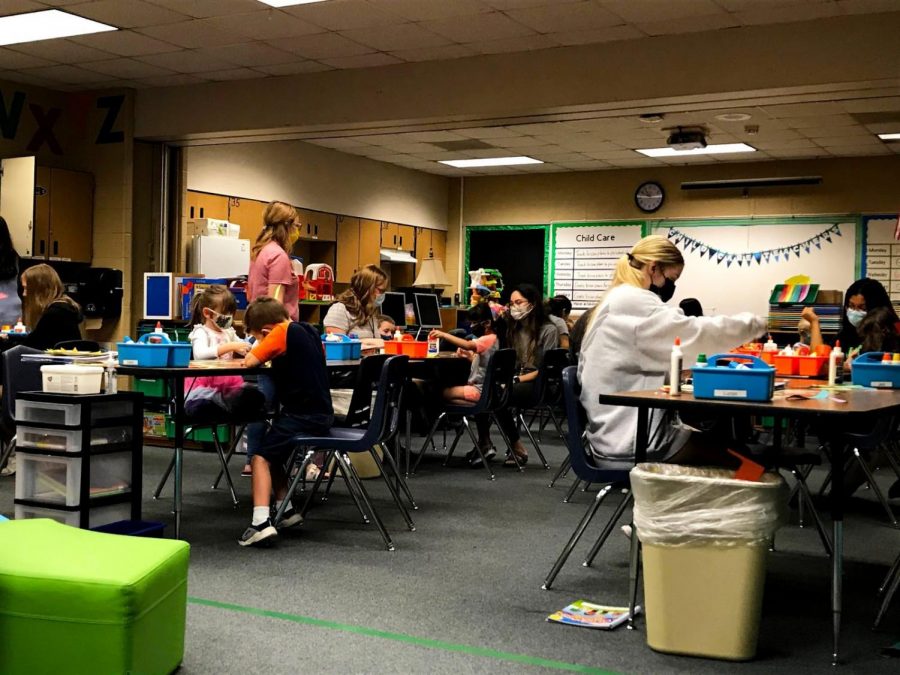 Highschoolers work with their preschool students on an arts and craft project. “Even through these difficult times, The kids are able to maintain innocence and joy and they are able to adapt to the adversities they’re faced with,” De Souza said. “As teachers, we do our best to have our students enjoy the process of learning.”