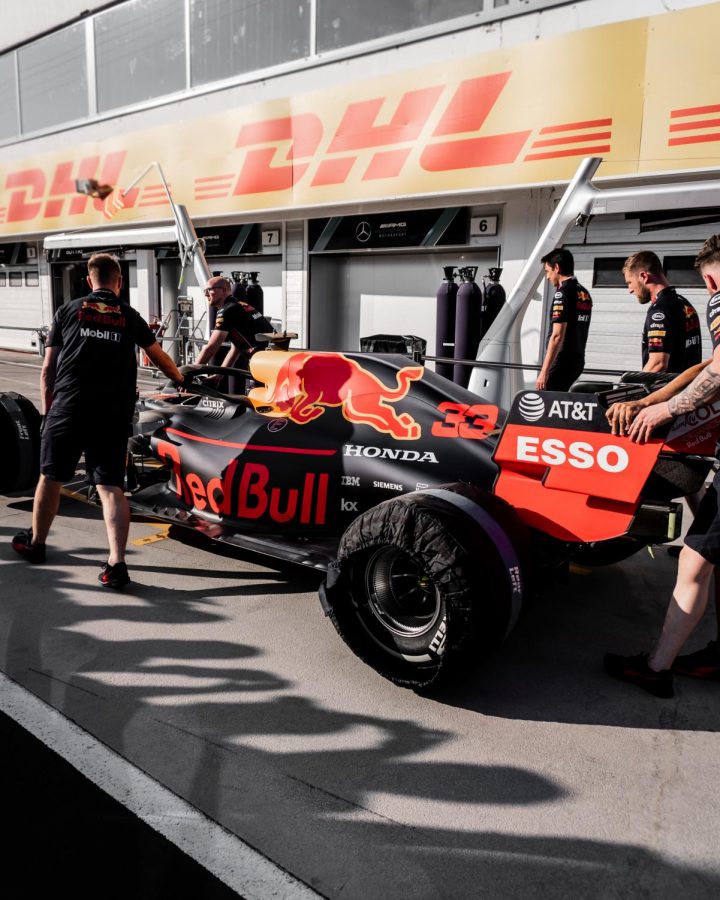 The cockpit crew prepares to work on the fan favorite Red Bull car. The Formula 1 World Championship races occur in different cities across the globe between March and December.