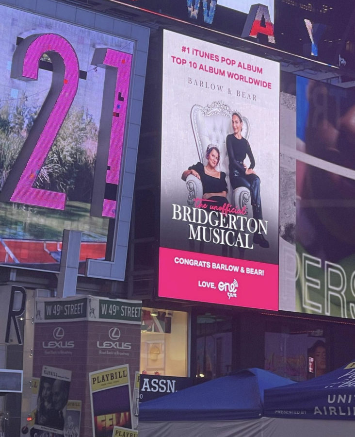 In Times Square, New York the new unofficial Bridgerton Musical created by Abigail Barlow and Emily Bear is displayed on a billboard for all to see. 