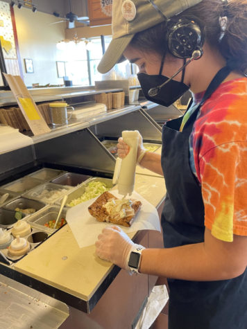 Melissa Borges makes a sandwich for a customer at Potbelly while working her summer job.