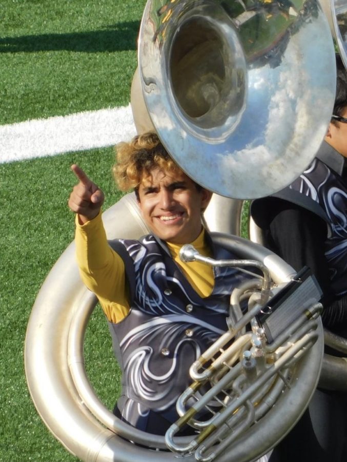 Senior+Josiah+Vargas%2C+the+band+president%2C+tuba+section+leader+and+former+drum+major+gives+a+post-performance+nod+to+the+audience.+Vargas+takes+his+role+as+a+leader+to+heart.+%E2%80%9CI+just+want+to+be+someone+people+can+talk+to+and+look+up+to%2C%E2%80%9D+Vargas+said.