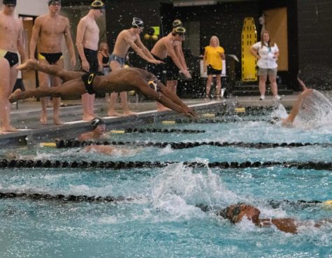 Senior and Varsity swimmer Kevin Georgetown swims a relay during the Black and Gold Meet. Freshmen swimmers were able to showcase their new strengths after weeks of preparation at the meet.