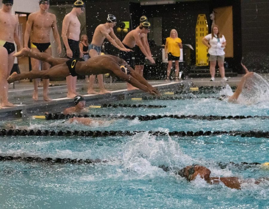 Senior+and+Varsity+swimmer+Kevin+Georgetown+swims+a+relay+during+the+Black+and+Gold+Meet.+Freshmen+swimmers+were+able+to+showcase+their+new+strengths+after+weeks+of+preparation+at+the+meet.