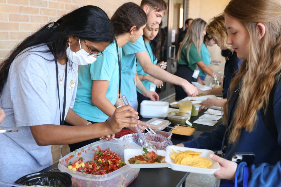 After Thursday’s meeting, officers of the Spanish National Honor Society prepare a salsa-tasting activity for their members to try, one of many activities to come in celebration of Hispanic Heritage Month.
