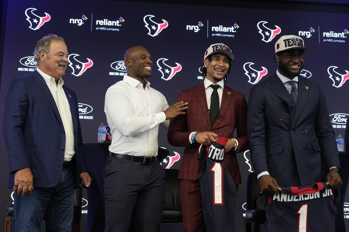 Houston Texans CEO Cal McNair and head coach DeMeco Ryans laugh with quarterback C.J. Stroud and linebacker Will Anderson Jr. during an introductory news conference, Friday, April 28, 2023, in Houston. Stroud and Anderson Jr. were selected in the first round by the Texans in the NFL football draft. These two rookies along with Ryans and others led the team to the  2023 division championship.