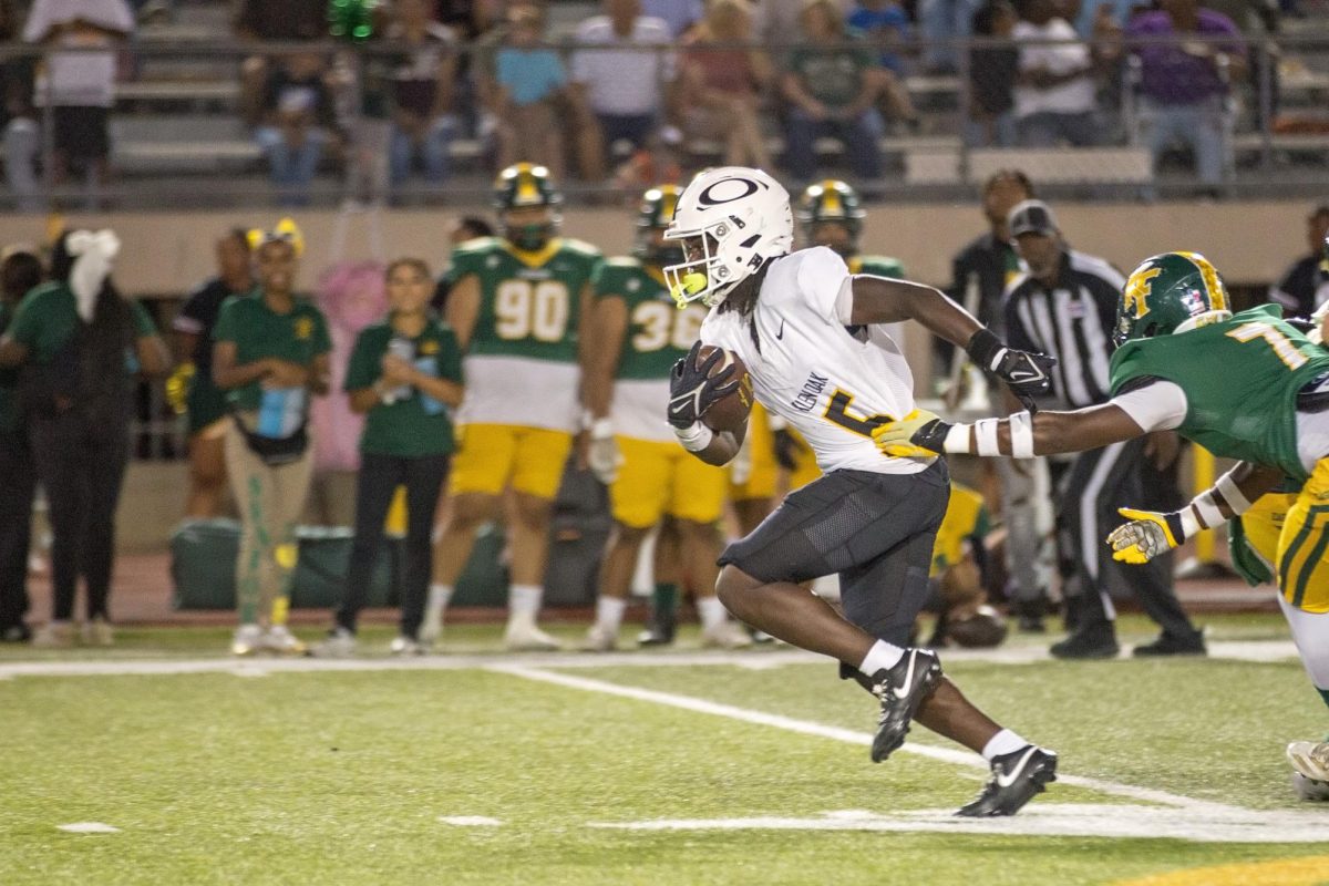 Charging down the field, freshman Micah Rhodes adds yardage for the Panther offense. Oak went on to beat Klein Forest, 35-3.