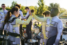 Wishing each other luck before the Bands of America contest in early October, senior Audrey Ellison and sophomore Davin Tsolenyanu give a high handshake.
