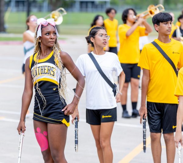 Varsity cheerleader junior Lyndon Nickerson makes time after school to practice the marching band show despite her busy schedule.