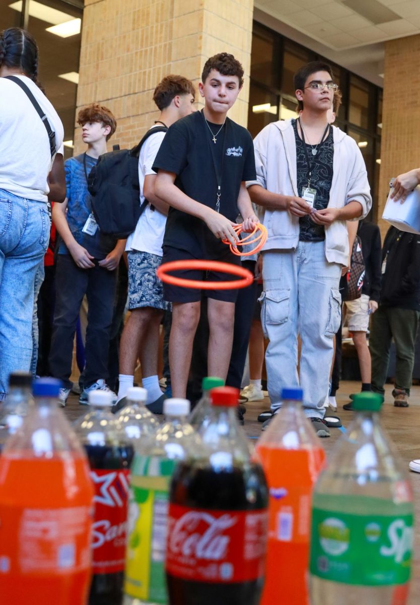 A carnival favorite, the ring toss hosted by Mu Alpha Theta, brings in hundreds of players hoping to win a two liter soda.