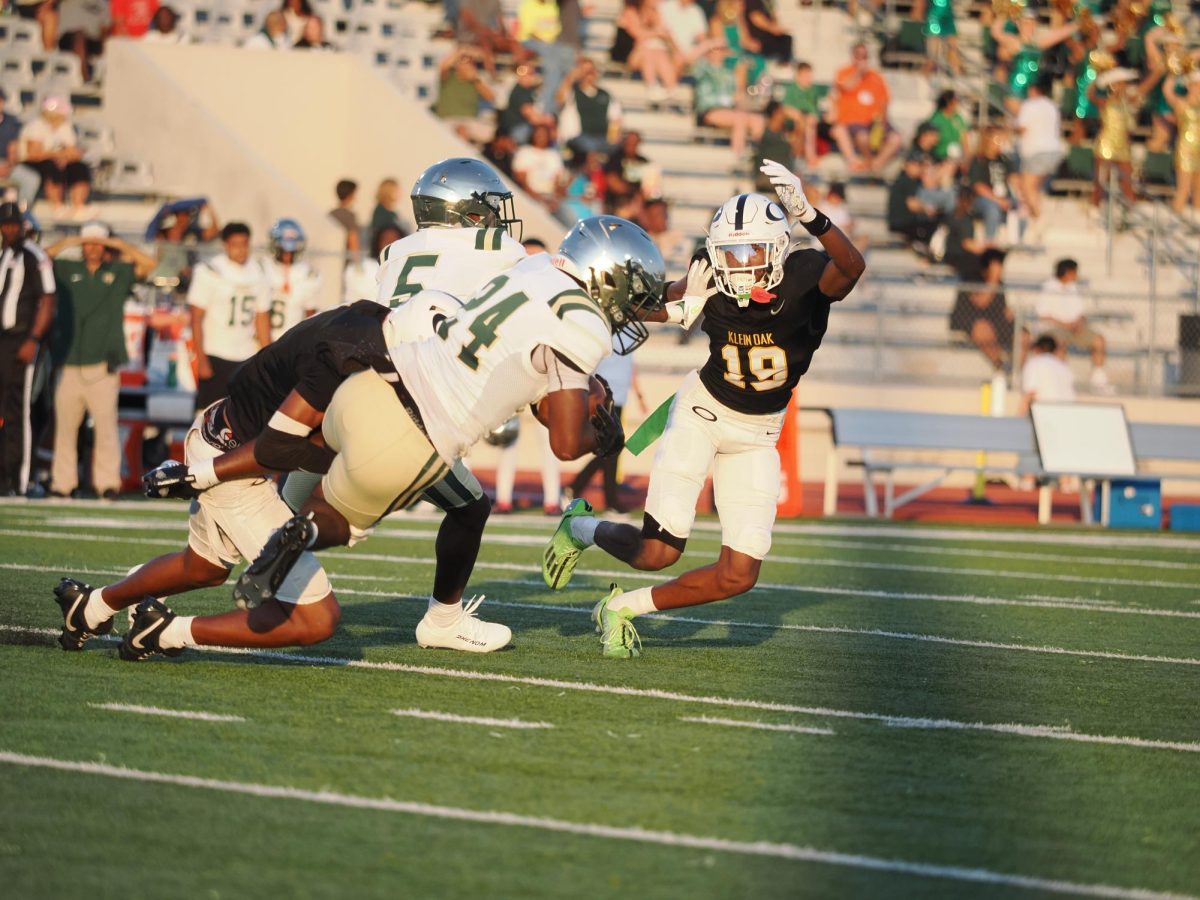 Rushing toward Cy Falls sophomore running back Deron Simpson, senior cornerback Harrison Carter goes in for the tackle.