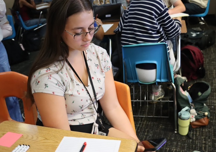 Throughout the school day, junior Claire Shinn is able to check her blood sugar levels on her cell phone using an app called Dexcom. Although students throughout the state have their personal technology banned during class, Shinn is able to check due to medical neccesity because she must continually monitor her glucose levels.