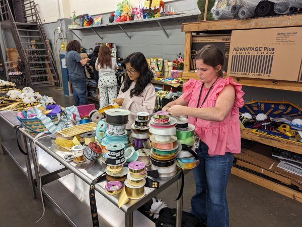 Choosing the perfect ribbon for their creations, Bhumika Neupane and Chloe DeBord plan the lengths that will work best on the garter or a mum they are making.