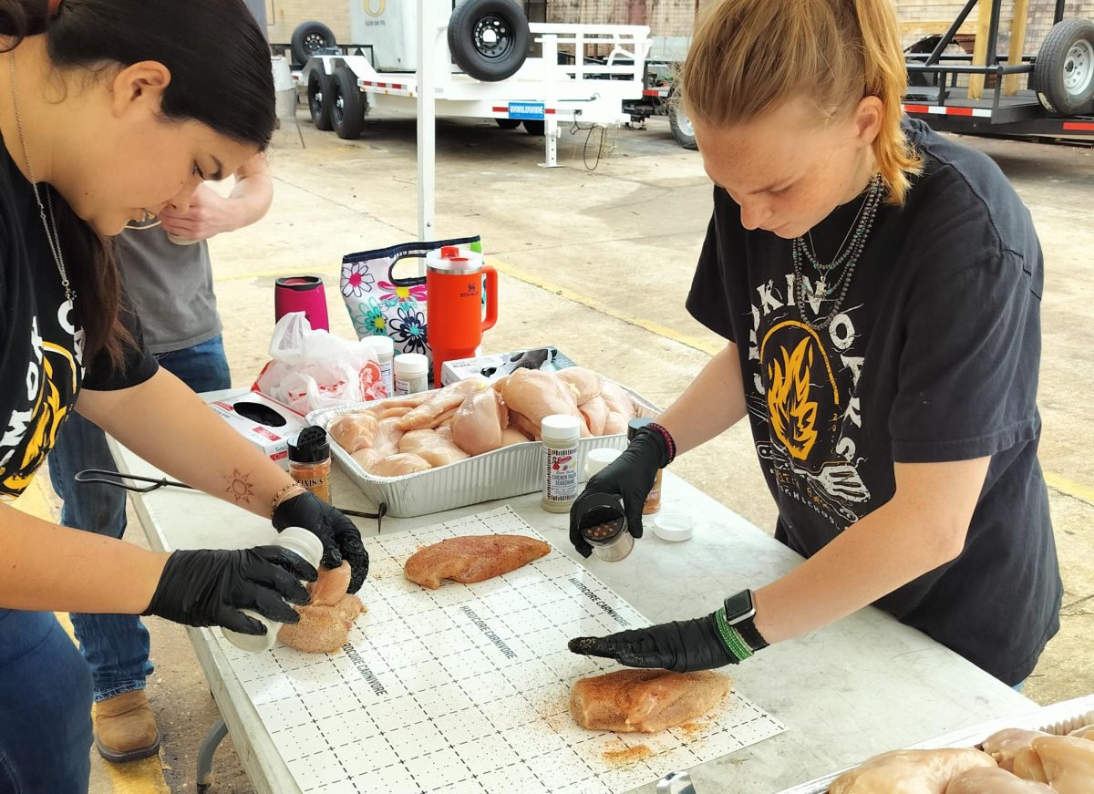 Barbeque Club members season chicken for the current cooking practice. Besides this, they also cook pork and beef.