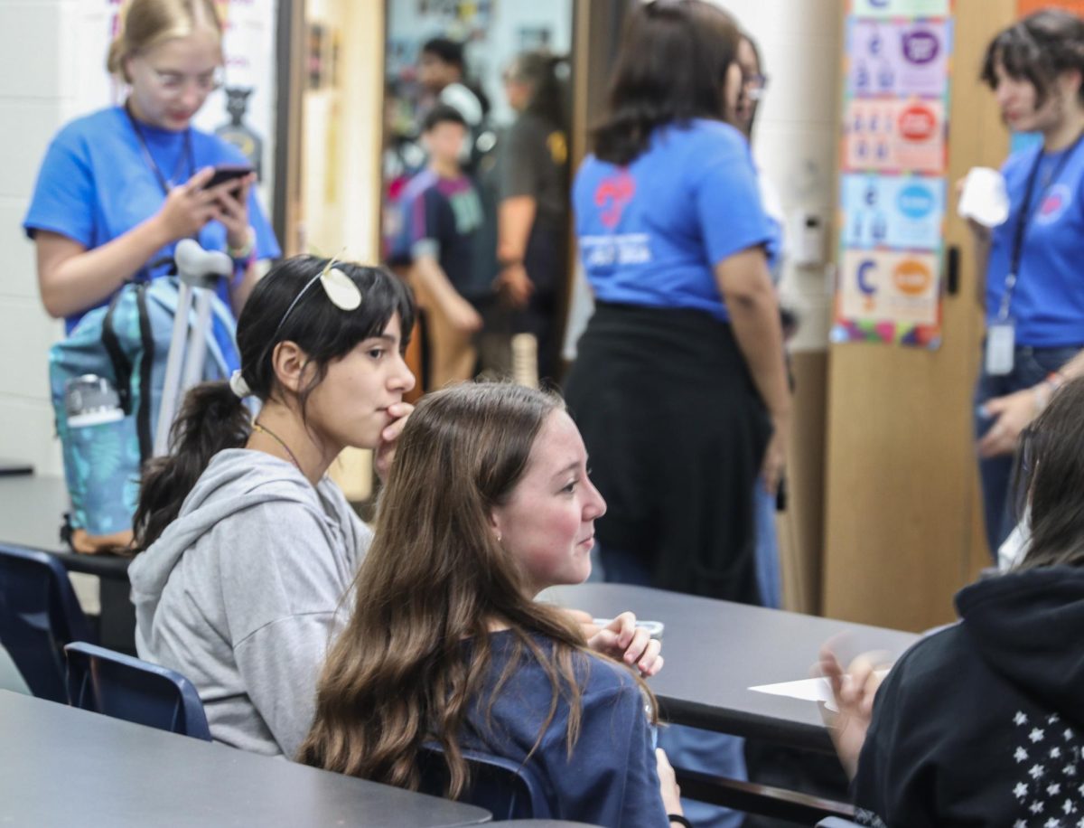At a French Club meeting after school, Rayln Miles and Serenity Garza discuss upcoming activities for the semester.