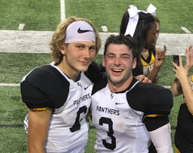2018 grad and now Oak World Geography teacher CJ Ward and fellow teammate Brandon Blair celebrate their first big win of their football season in 2016 against Cy Creek.