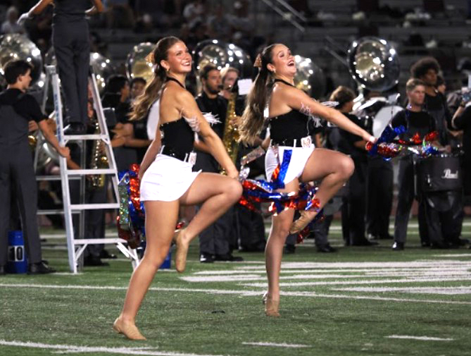 Dancing during a football game against Magnolia High School. From football to basketball to their own competitions, the Strutters dance all year to keep their legacy alive.